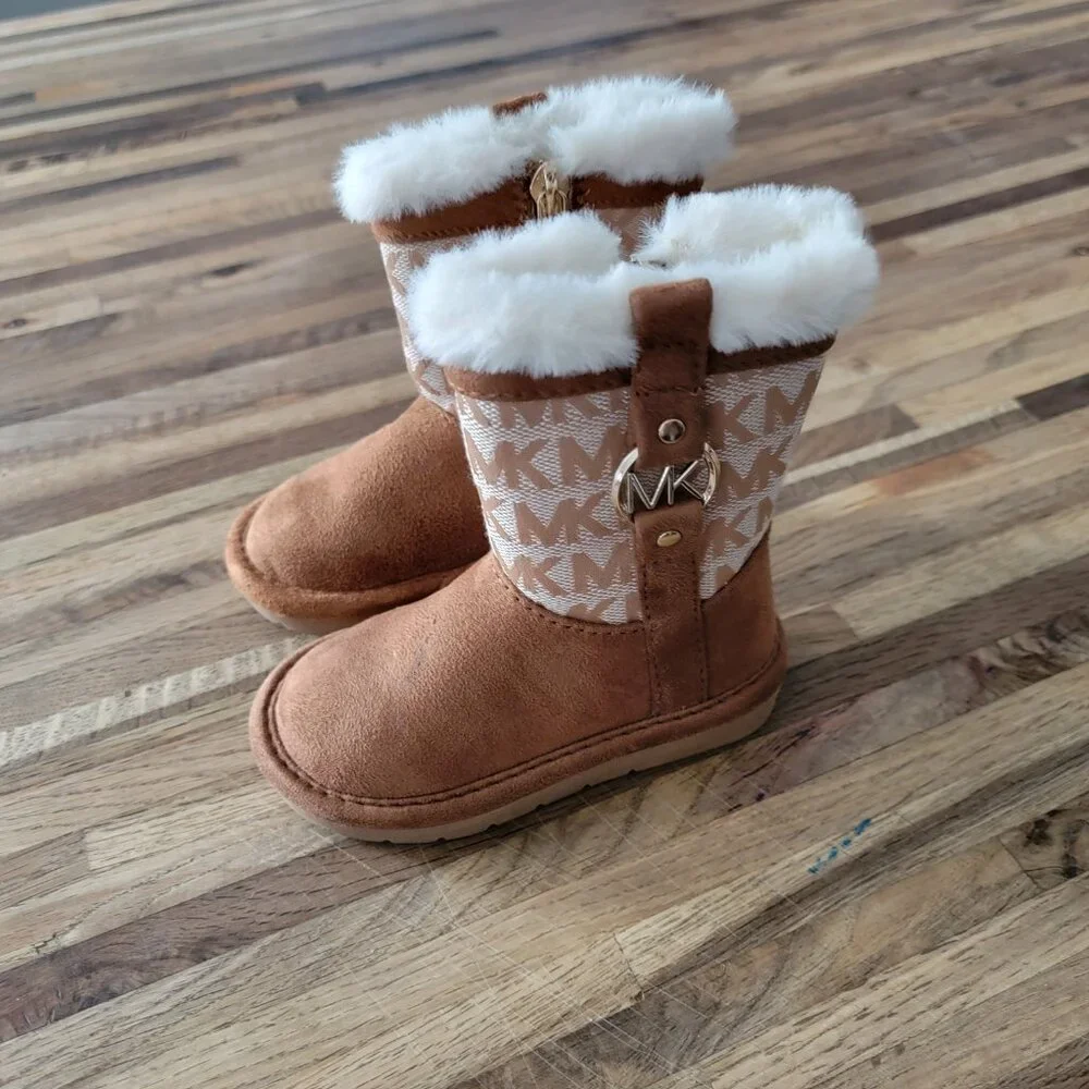 Michael Kors Yancy Girl Toddler boots featuring a brown logo print and faux fur